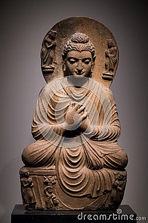 Ancient seated Buddha schist statue image in 2nd-3rd century, Kushan dynasty from Gandhara, Pakistan Stock Photo