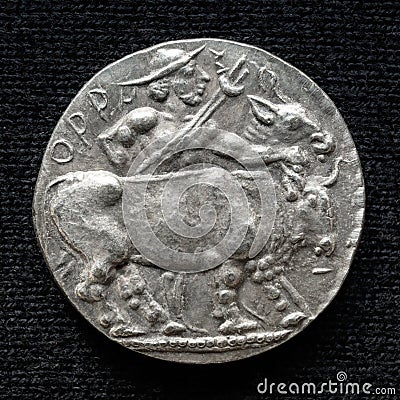 Ancient silver coin with image of bull, old rare money Stock Photo