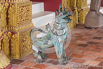 Ancient Singha Lion, Magic Animal in Buddhism Legend, Statue Aged Over 150 Years Stock Photo