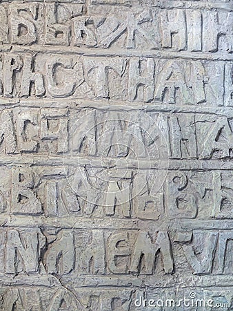 Ancient Slavic illegible inscriptions on a stone Stock Photo