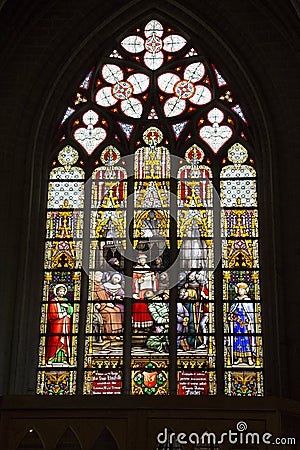 An ancient stained glass window in the Cathedral of St. Michael and St. Gudula Editorial Stock Photo