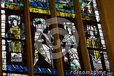Ancient stained glass windows on a religious theme in the Cathedral of the Blessed Virgin Mary in Munich Germany. Editorial Stock Photo
