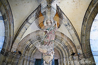 Archangel Michael on entrance portal of parish Church Saint Michael, Schwabisch Hall, Baden-Wuerttemberg, Germany Stock Photo