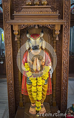 Statue of the goddess Prithvi with the cow head in the Hindu temple Shree Laxminarayan in Goa, India Stock Photo