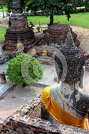 Ancient statues of buddha sitting, at Wat Yai Chaimongkol at Ayutthaya National Park, Thailand. Editorial Stock Photo