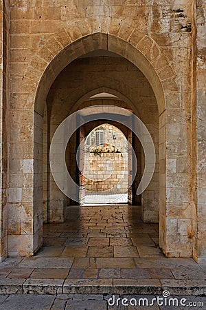 Ancient stone arch in Jerusalem Old City Stock Photo