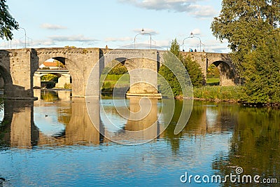Ancient stone bridge across Aude River Stock Photo