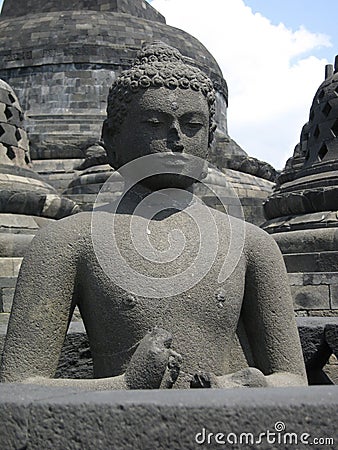 Ancient stone buddha at the Borobudur Stock Photo