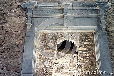 Ancient stone fireplace uncovered to void beyond Stock Photo