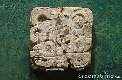 Ancient stone glyph made by the natives of the mexican maya cult Editorial Stock Photo