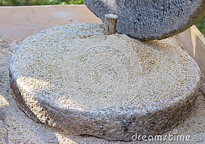 The ancient stone hand grain mill Stock Photo