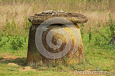 Ancient stone jar with stone cover in a Plain of Jars Site 1 near Phonsavan, Xiangkhouang province, Laos. Stock Photo