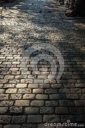 Ancient stone roadbed as background Stock Photo