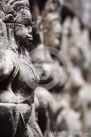Ancient stone sculpture in Angkor Wat. Cambodia. Stock Photo