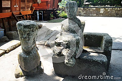 Ancient stone statue of Batu Kursi Raja Siallagan or Huta Stone Chair of King Siallagan for indonesian people and foreign traveler Editorial Stock Photo