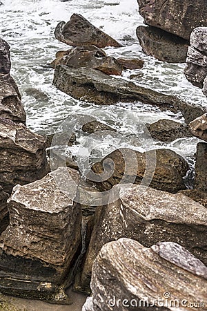 Ancient stones on agitated sea Stock Photo