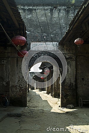 Ancient street with arched gate Stock Photo