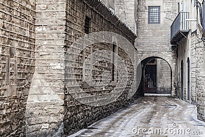 Ancient street stone walls in El Born quarter of Barcelona. Editorial Stock Photo