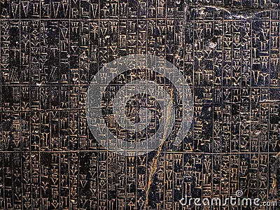 Ancient sumerian stone carving with cuneiform scripting Stock Photo