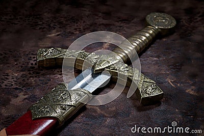 Ancient sword on a beautiful background Stock Photo