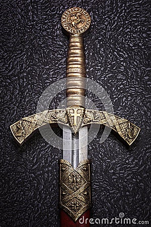 Ancient sword on a beautiful dark background Stock Photo