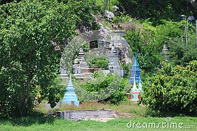 Ancient Thai Cemetery Landscape at a Thai Temple on the Mountain in Thailand Stock Photo