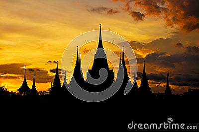 Ancient Thai temple silhouette in twilight sky background Stock Photo