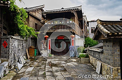 Ancient tile-roofed house in cloudy spring afternoon Editorial Stock Photo