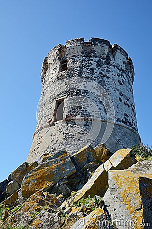 Ancient tower in the Corican coast Stock Photo