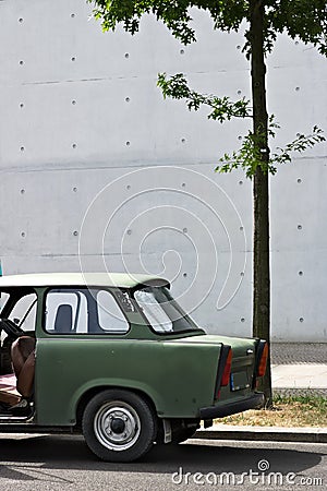 Ancient Trabant car. Vintage Trabant high-buildings parked in the German parliament district in Berlin Editorial Stock Photo