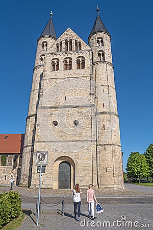 Ancient two towers of Church Monastery of Our Beloved Woman Kloster Unser Lieben Frauen in historical downtown of Magdeburg at Editorial Stock Photo