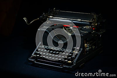 Ancient typewriter on a black background Stock Photo