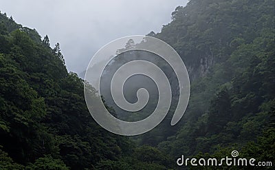 Ancient valley fading into mist Stock Photo