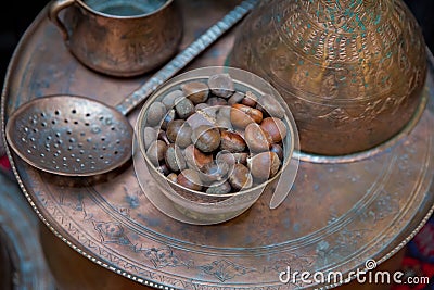 Ancient vintage Copper bowl . Copper containers. Spoonful of copper. Chestnut. Editorial Stock Photo