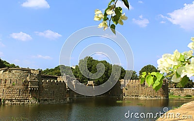 Ancient wall and fort battlements with trench landscape Stock Photo