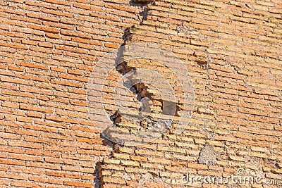 Ancient wall several layers of red brick, the crack collapses Stock Photo
