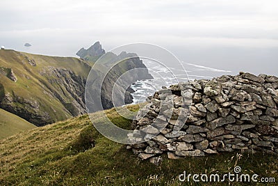 Ancient wall structures and shelters, i.e. cleits, on the remote archipelago of St Kilda, Outer Hebrides, Scotland Stock Photo