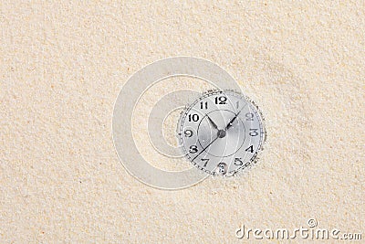 Ancient watch shipped in sand Stock Photo