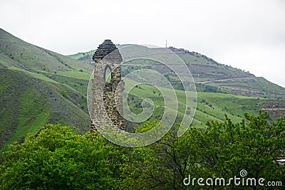 Ancient watchtower in the Caucasus mountains Stock Photo