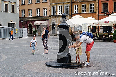 Ancient water column at Old Town Market Square Editorial Stock Photo