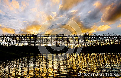 On the ancient wooden bridge is another landmark that many tourists come to visit during their holidays to take photos of the sunr Stock Photo