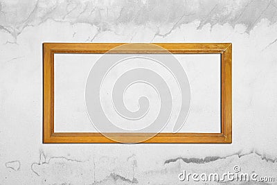 ancient wooden frame on gray cement wall cracked Stock Photo