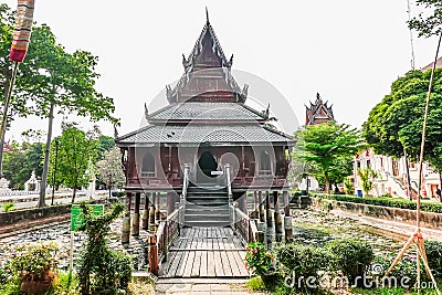 Ancient wooden monastery and The library on stilts in Wat Thung Si Muang temple in Ubon Ratchathani ,Thailand Stock Photo