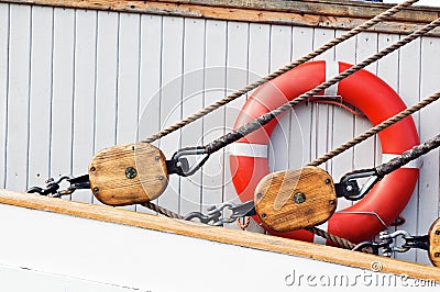 Ancient wooden sailboat pulleys and ropes Stock Photo