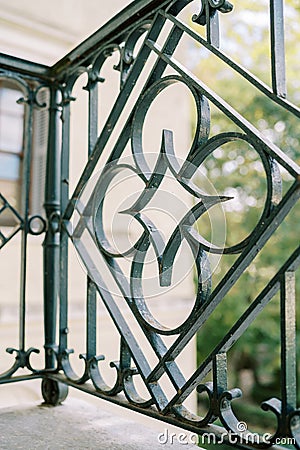 Ancient wrought iron fence of a villa terrace Stock Photo