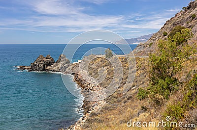 Andalusia`s rocky coast east of Motril on a warm summer day. Stock Photo