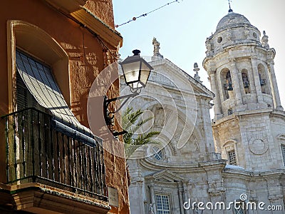 Andalusian balcony with a white cathedral behind to Cadiz in Spain. Editorial Stock Photo