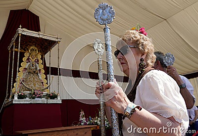 Andalusian woman walking on the streets of Andalusia during the Pilgrimage of the Virgin of El Rocio Editorial Stock Photo