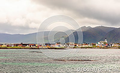 Andenes village panorama with multiple houses and mountains in the background, Lofoten islands, Andoy Municipality, Vesteralen Stock Photo