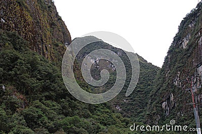 The Andes Mountains covered in shrubs and vegetation in Aguas Calientes, Peru Stock Photo